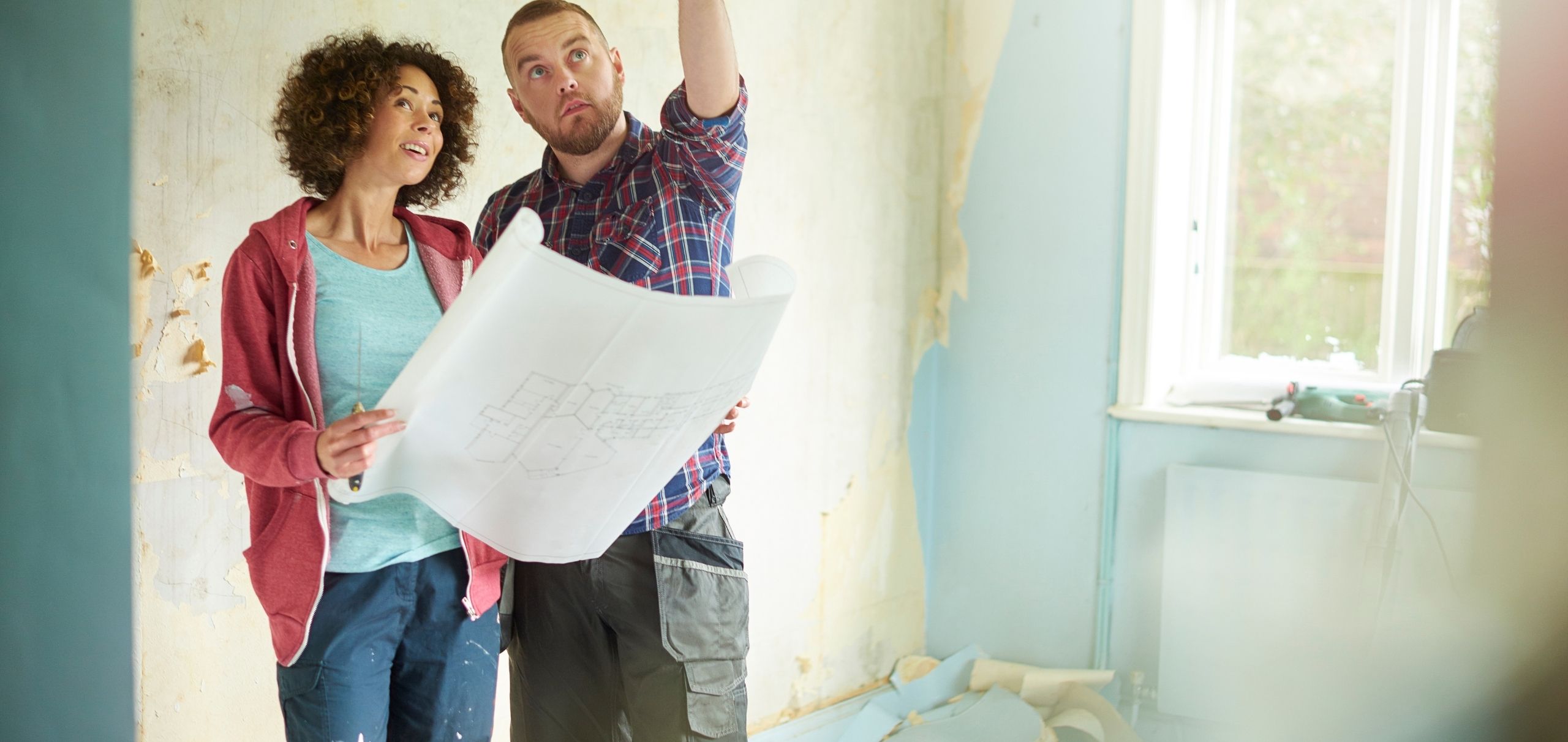 Home remodeling planning with blueprints and material samples
